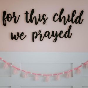 “For this child we prayed” wooden cutout sign